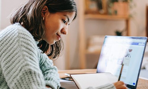 A student on her computer. 