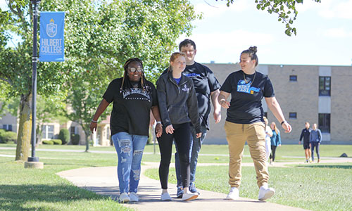 Students walking around Hilbert Campus