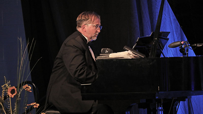 Dr. Brophy playing the piano