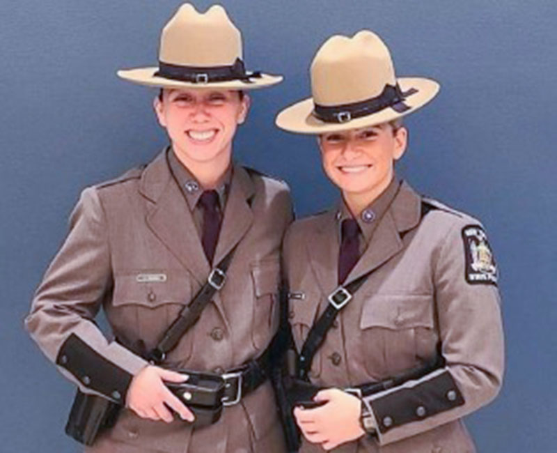 Jennifer DiAngelo and Erica Schneider pose as Class of 2022 for the NYS police.