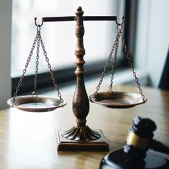 An image with a gavel and scales of justice