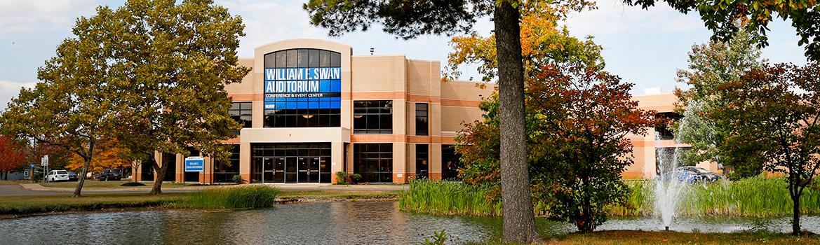 The pond and Swan Auditorium at Hilbert College