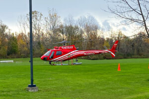 An ESCO helicopter landing on Hilbert campus.