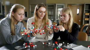 Hilbert students studying molecules in Biology class.