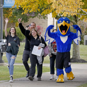 Hilbert campus walks around campus with Bert, our Hawk Mascot.