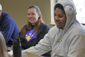 Students talking in class at Hilbert.