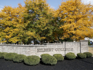 Hilbert College's front brick wall.