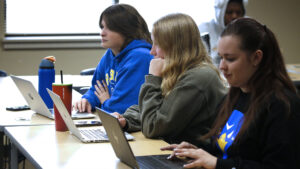 Hilbert students working on their computers in class.