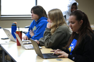 Hilbert students working on their computers in class.