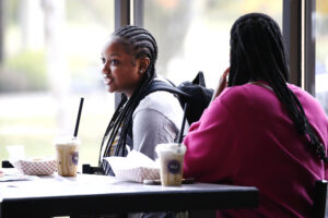 Students talking a Hilbert's Spot Coffee.
