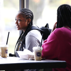Students talking a Hilbert's Spot Coffee.
