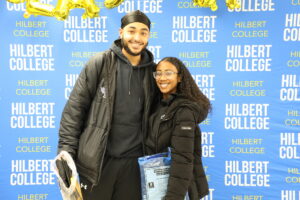 Two students pose at Hilbert College's Graduate Fair.