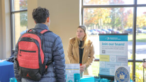 Hilbert College Career Expo with students talking to the Department of Taxation & Finance.